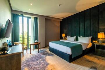 Фото номера Большой двухместный номер с 1 кроватью Отель Aurora Resort Tsaghkadzor г. Цахкадзор 7