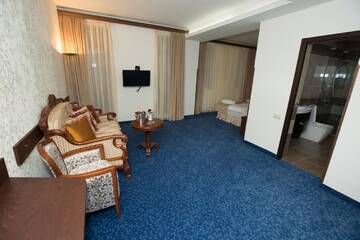 Фото номера Двухместный номер Делюкс с 1 кроватью Отель Faria Boutique Hotel г. Цахкадзор 4